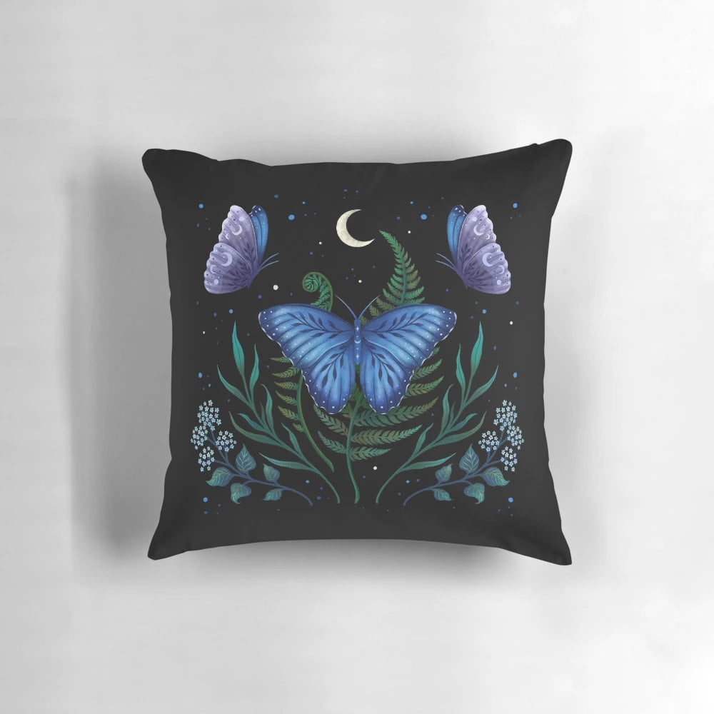 Blue Morpho butterfly resting on a pillow under the moonlight