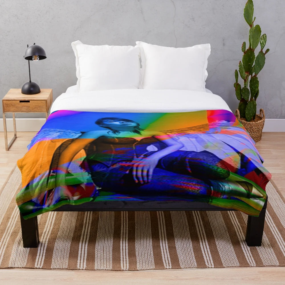 Plush blanket with colorful, surreal abstract pattern