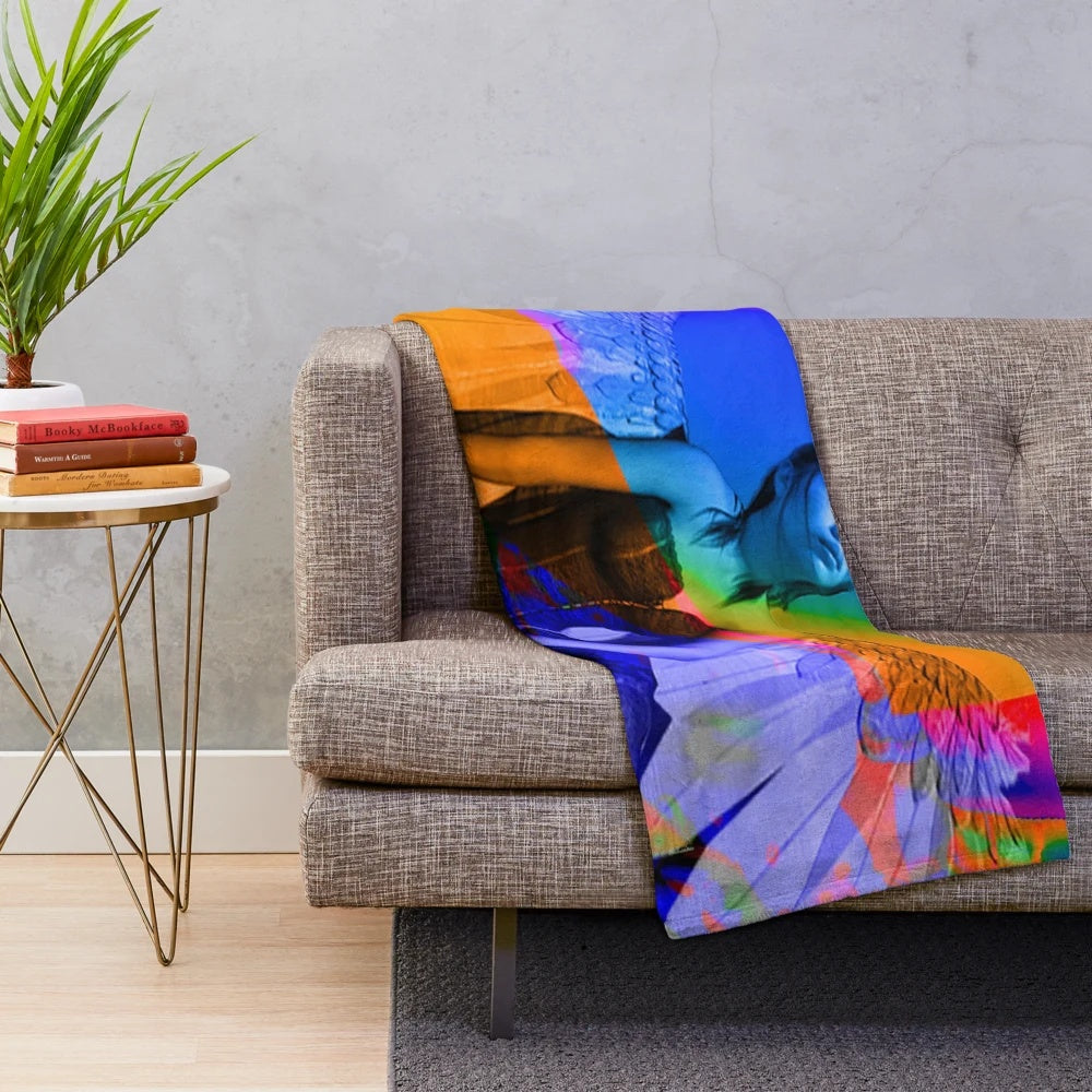 Plush blanket with colorful, surreal abstract pattern