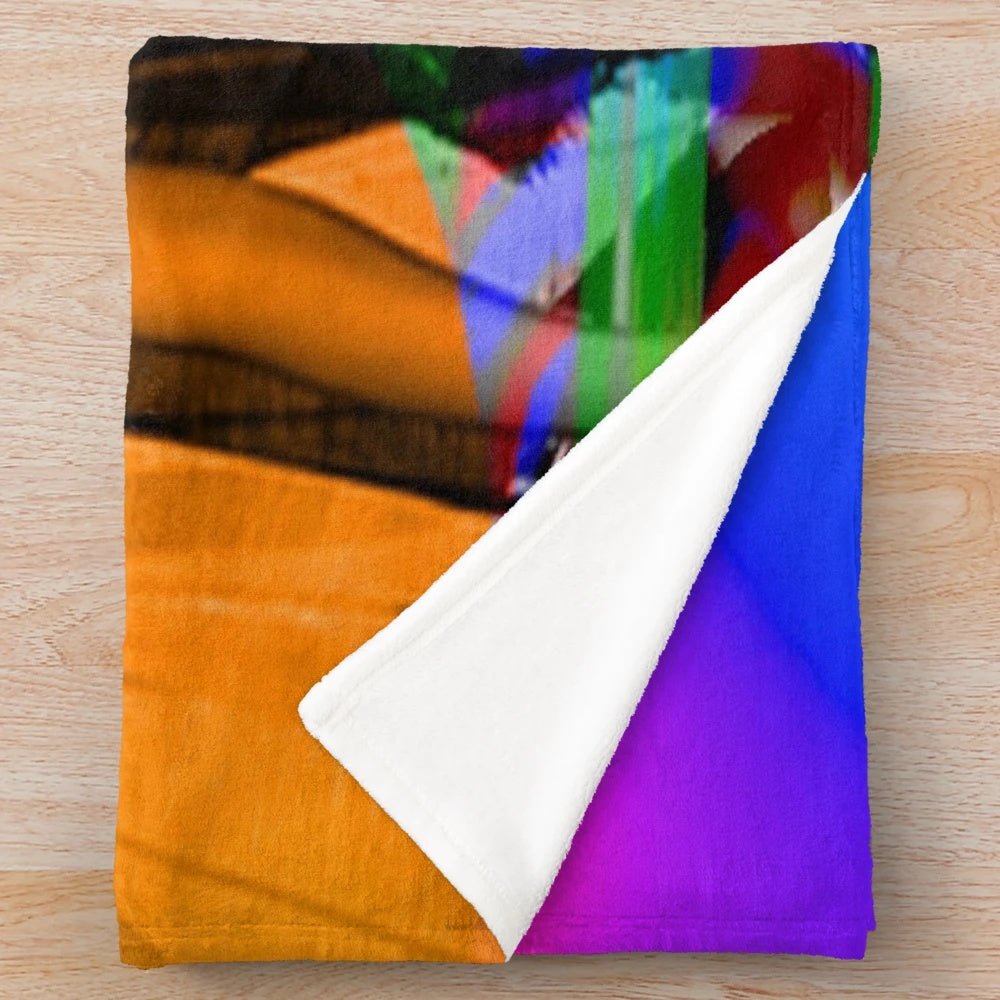 Plush blanket with colorful, surreal abstract pattern