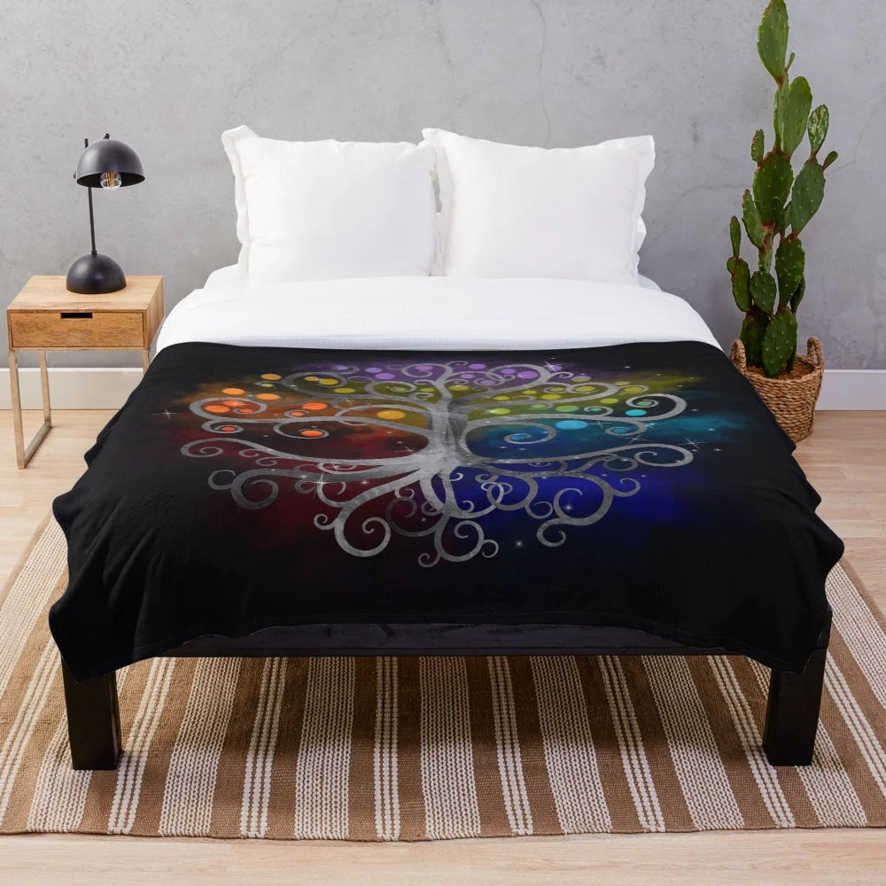 Silver and colorful swirling design of the Tree of Life on a plush blanket
