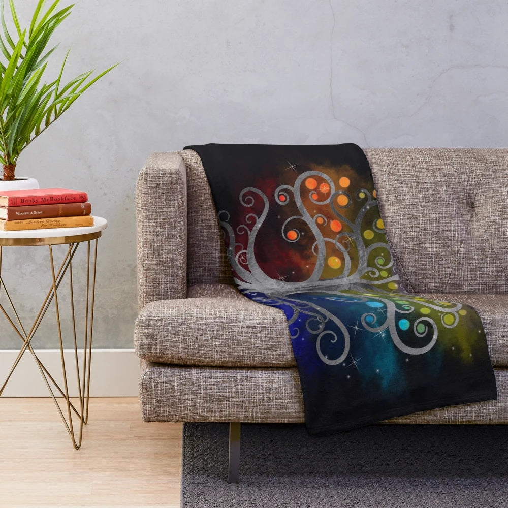 Silver and colorful swirling design of the Tree of Life on a plush blanket