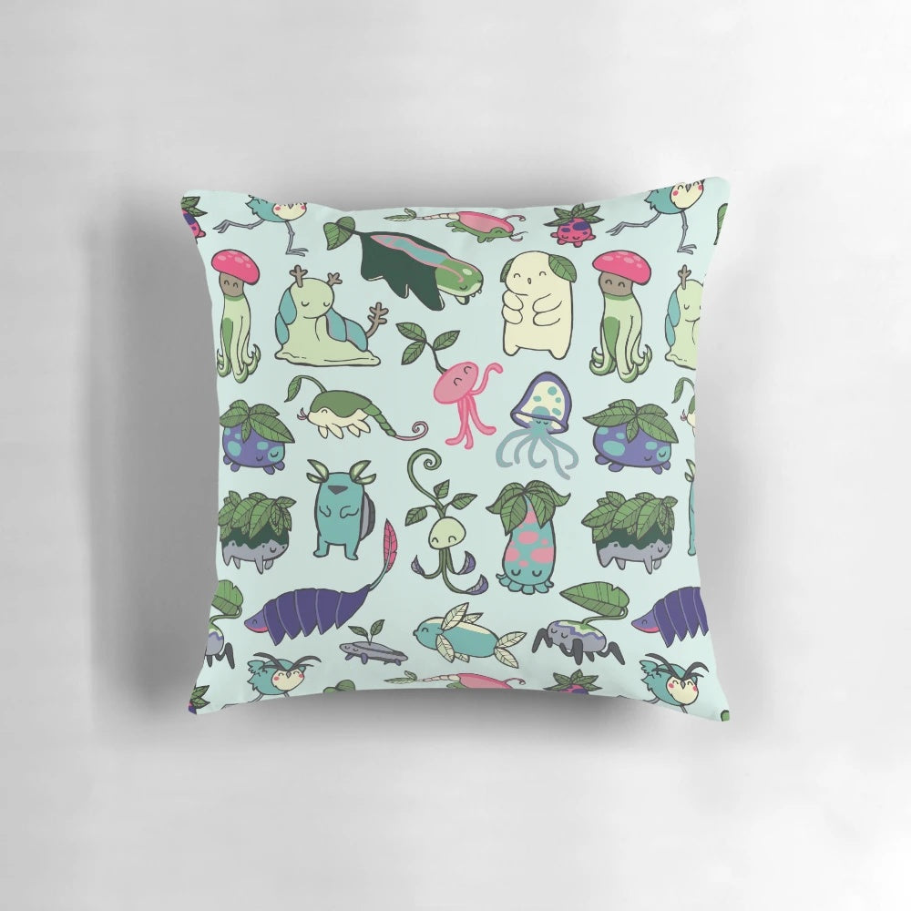 A whimsical pillow featuring a colorful pattern inspired by the spirits and characters of Avatar: The Last Airbender and The Legend of Korra.