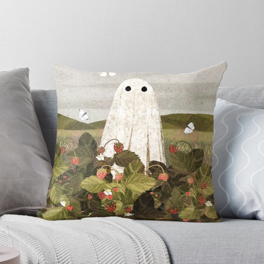 Soft, artistic pillow featuring a field of whimsical strawberries and ghostly apparitions