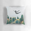 Surreal collage design featuring a floating cactus, vintage flowers, and a free-falling pillow.