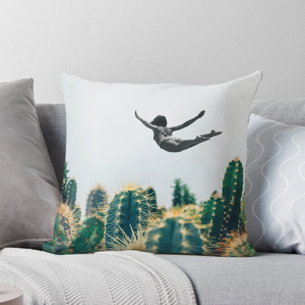 Surreal collage design featuring a floating cactus, vintage flowers, and a free-falling pillow.