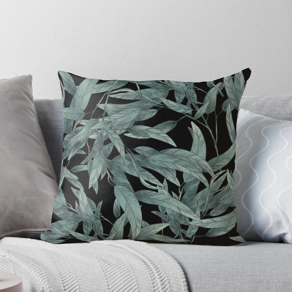 Eucalyptus leaves hand-drawn graphic on a black and white modern pillow