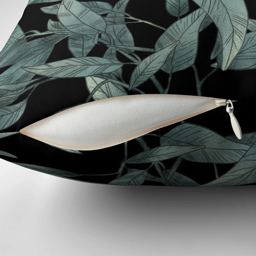 Eucalyptus leaves hand-drawn graphic on a black and white modern pillow
