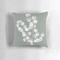 Eucalyptus and sage green botanical art design printed on a throw pillow.