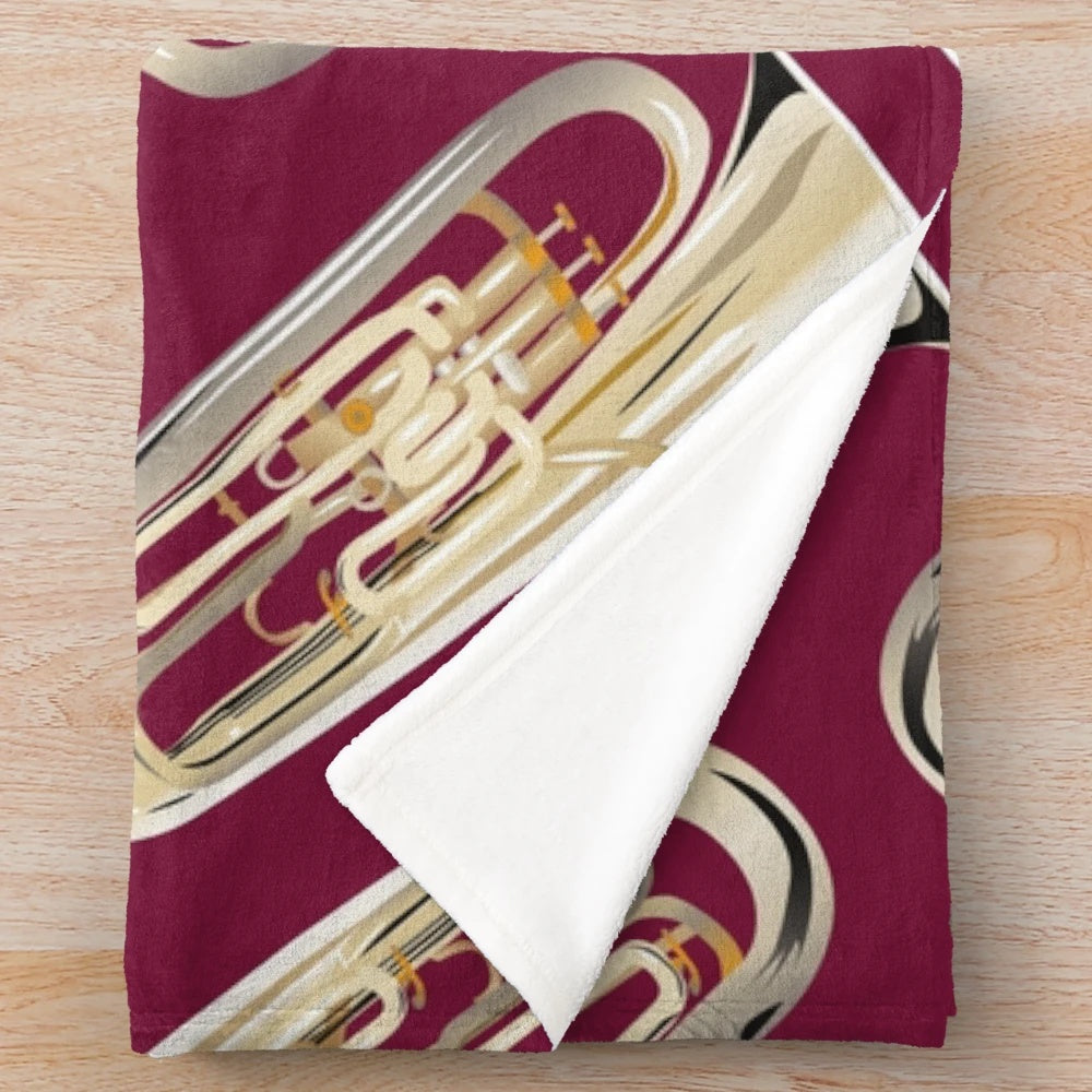 Dark red plush blanket with an euphonium design