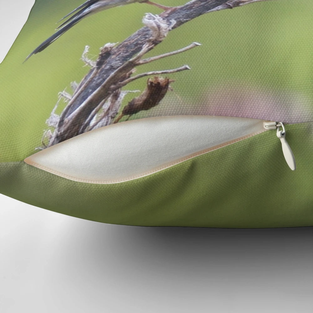 Photograph of a decorative pillow featuring a European goldfinch bird illustration by artist David Irwin.
