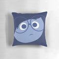 A decorative pillow featuring a character from the Pixar film "Inside Out" that invokes feelings of sadness and deep reflection.