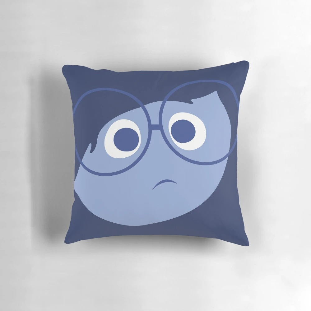 A decorative pillow featuring a character from the Pixar film "Inside Out" that invokes feelings of sadness and deep reflection.