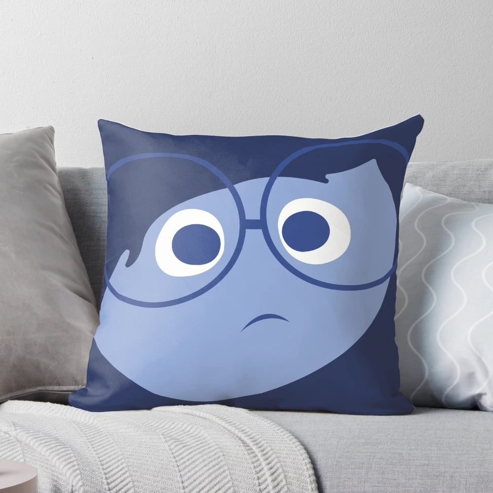 A decorative pillow featuring a character from the Pixar film "Inside Out" that invokes feelings of sadness and deep reflection.