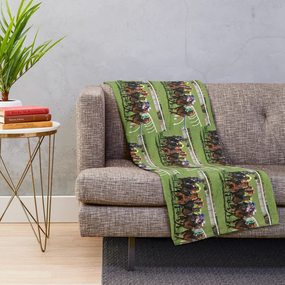 Plush blanket with horse racing action design