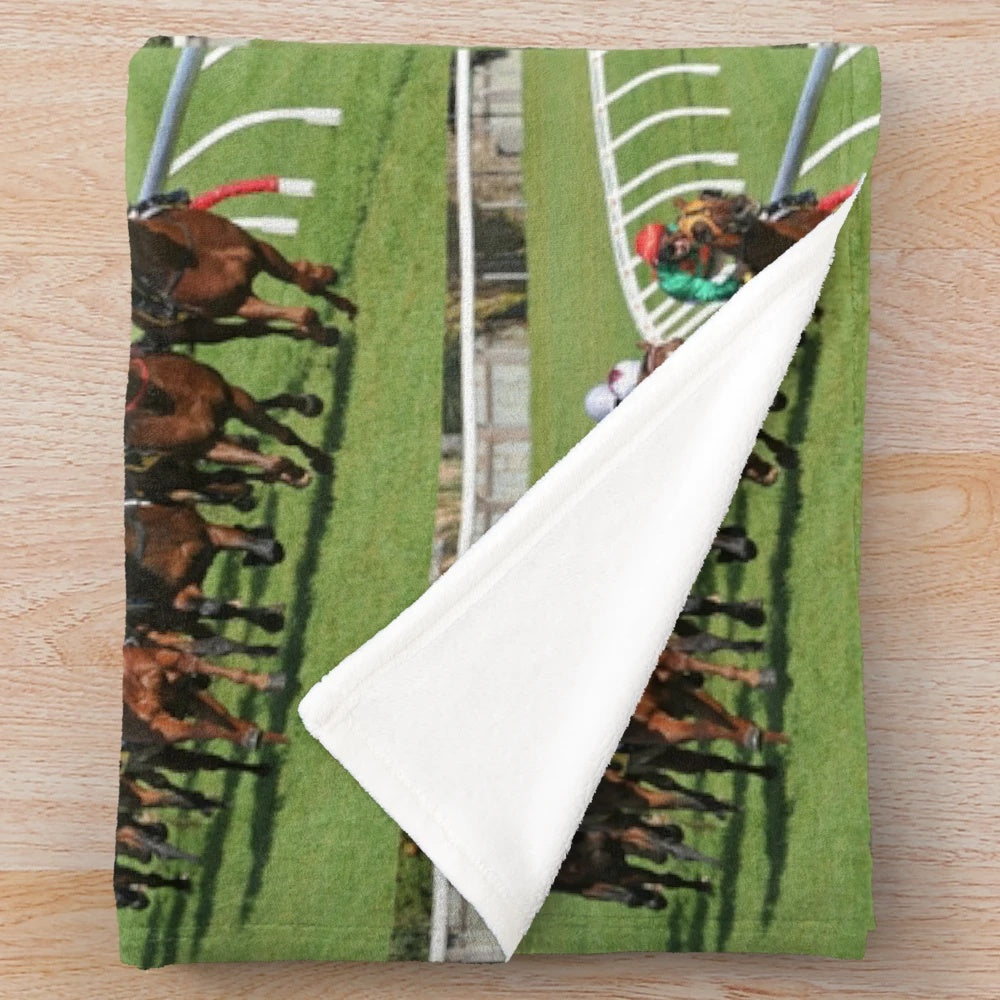 Plush blanket with horse racing action design
