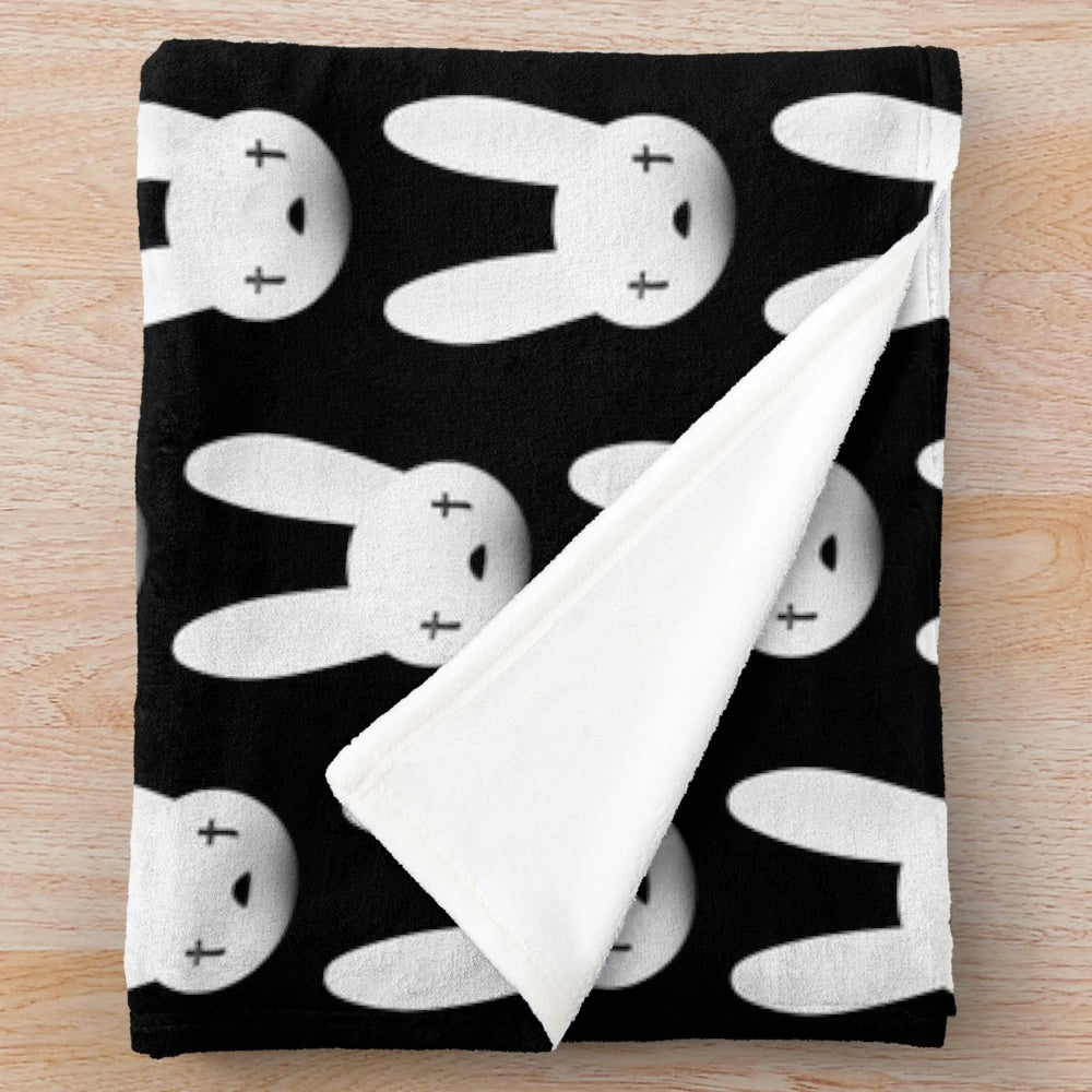 Soft and cozy plush blanket featuring the iconic Bad Bunny logo