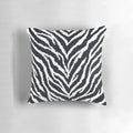 Closeup of a high-quality zebra fur print decorative pillow with a realistic, detailed animal pattern.