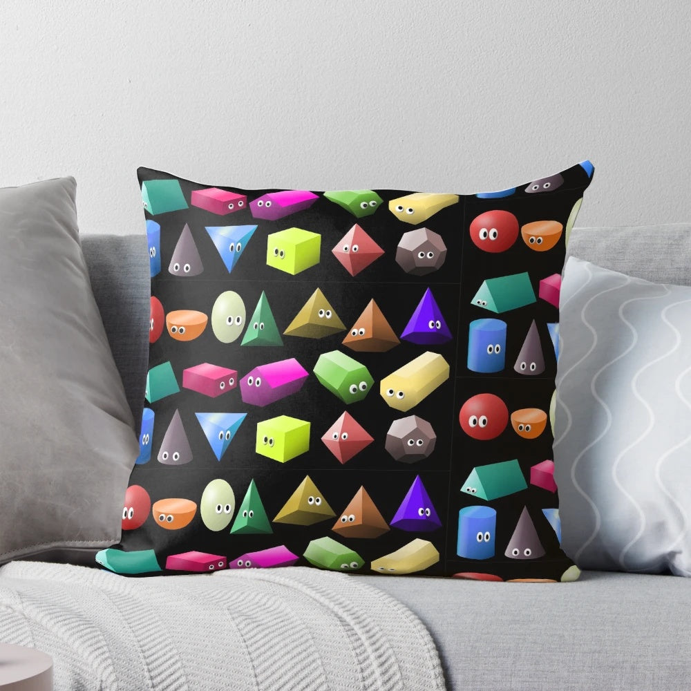A colorful 3D shapes pillow featuring spheres and cubes, designed to teach children about geometry.