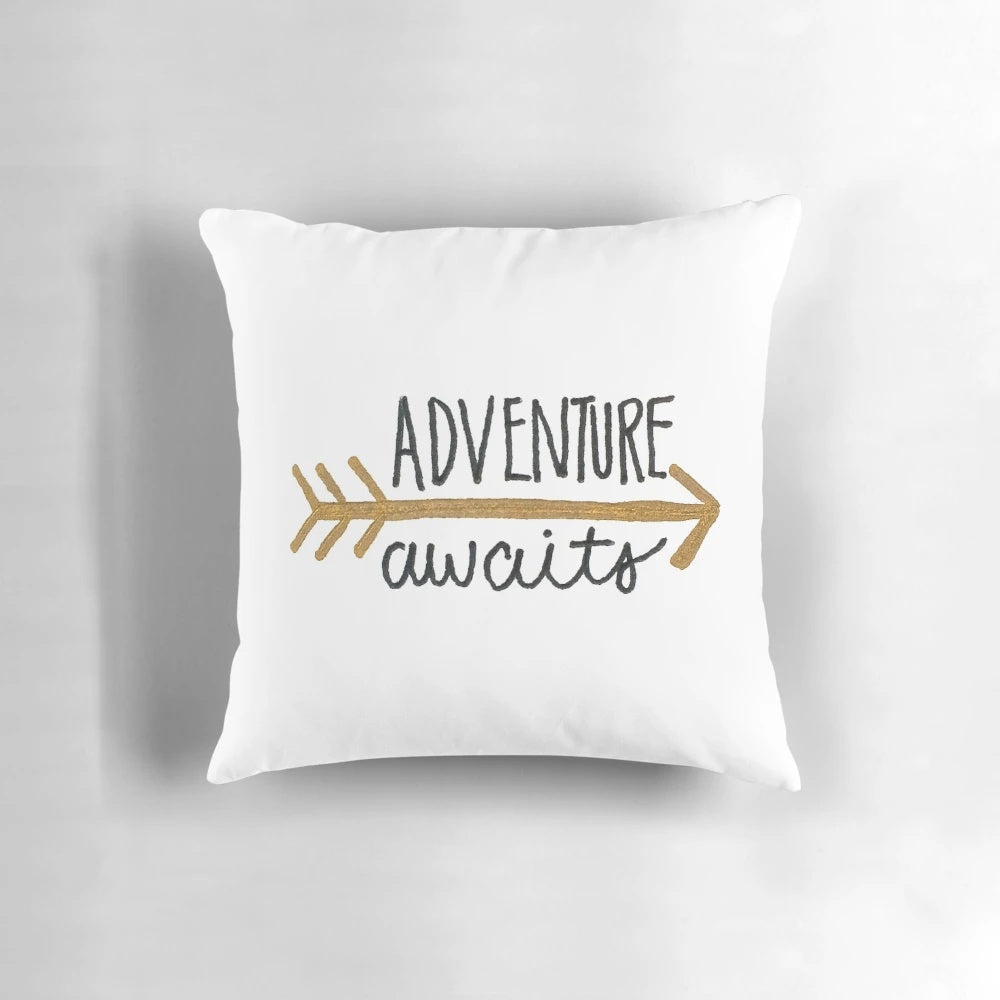 Black and gold hand lettered "Adventure Awaits" pillow