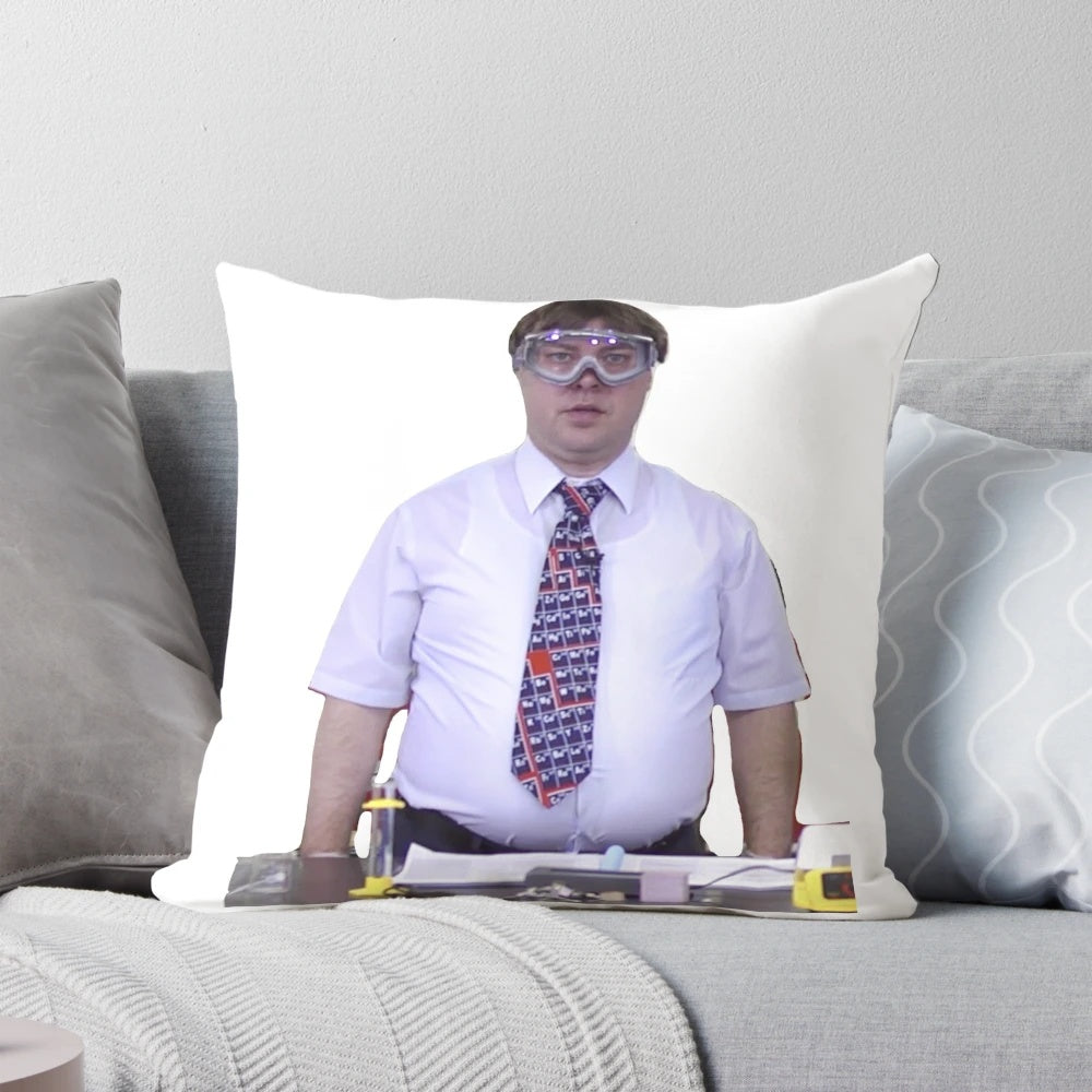A plush pillow featuring a smiling man wearing goggles, representing the University of Wisconsin's chemistry lab.