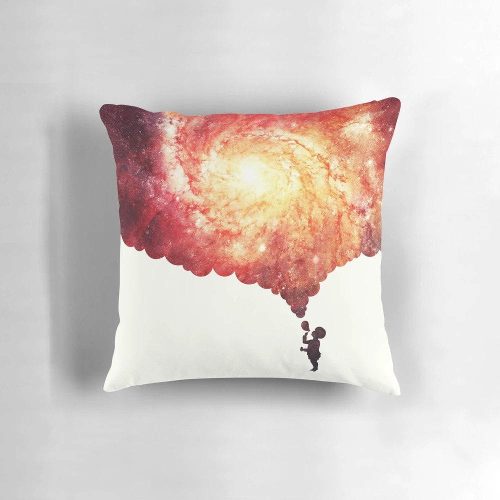 Pillow with a colorful, space-inspired design featuring planets, galaxies, and celestial elements.