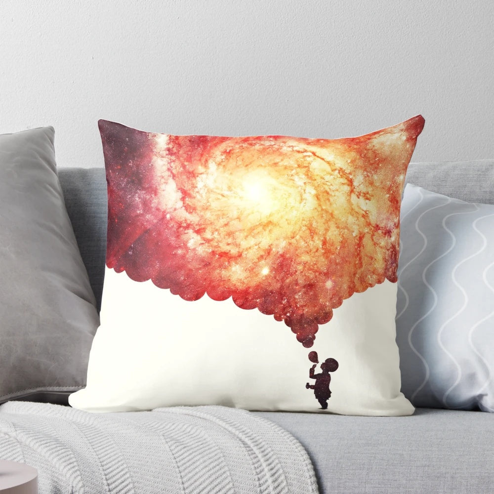 Pillow with a colorful, space-inspired design featuring planets, galaxies, and celestial elements.