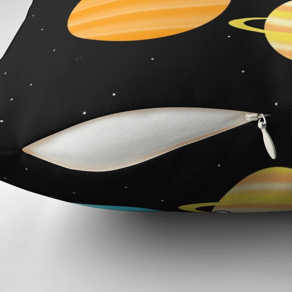 A colorful and whimsical pillow featuring illustrations of the planets in the solar system.