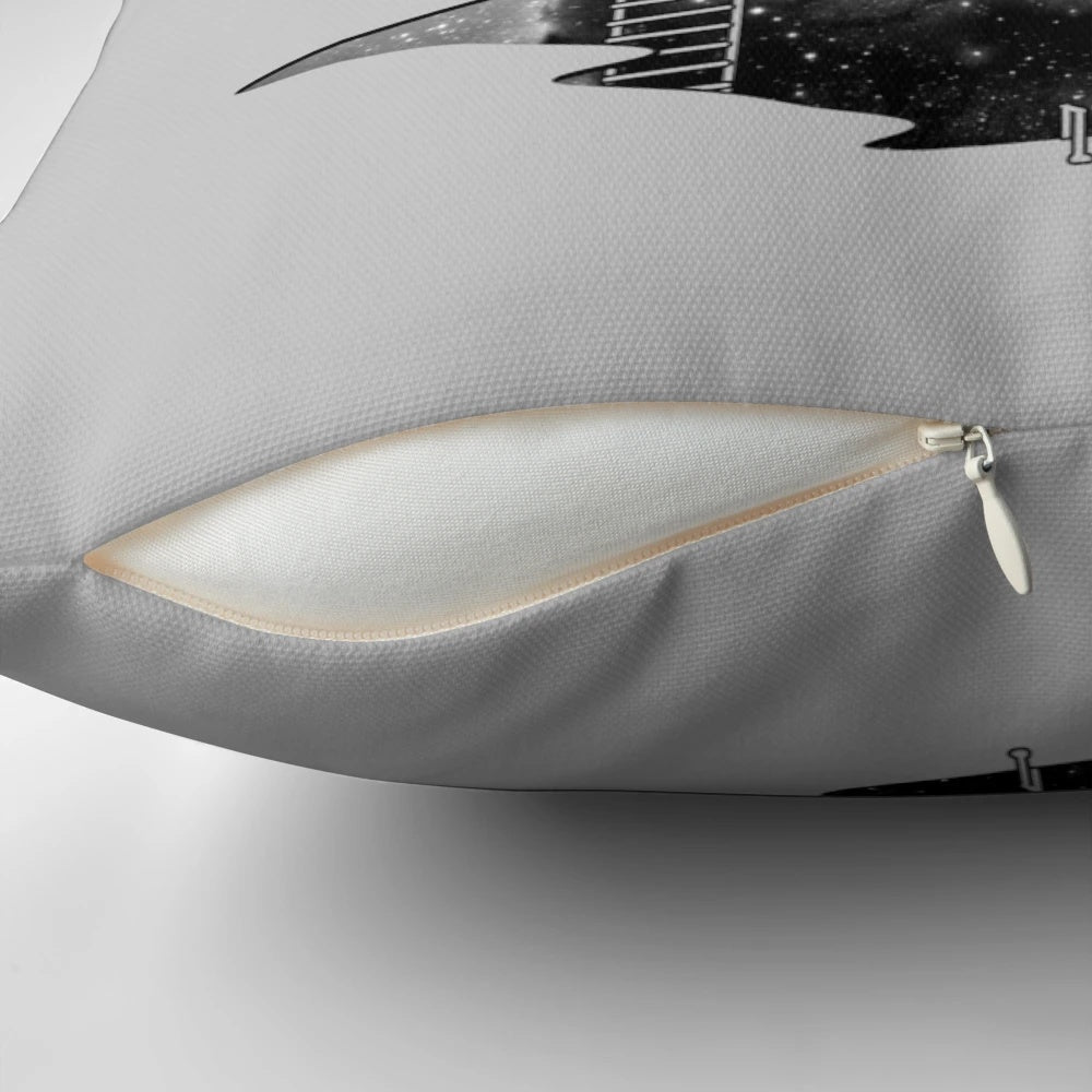 A plush pillow featuring an astronaut diving through the stars and galaxies of outer space.
