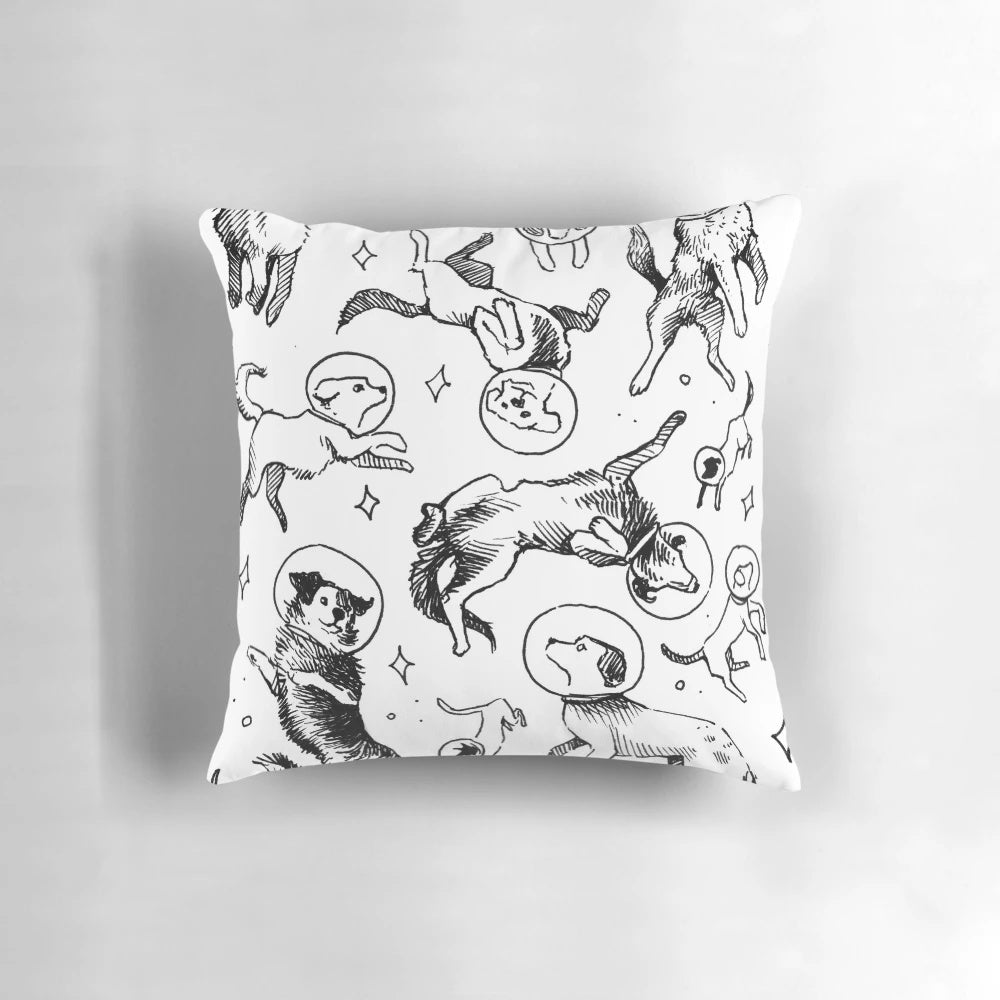 Pillow featuring a whimsical pattern of dogs exploring space, astronauts, and the galaxy.
