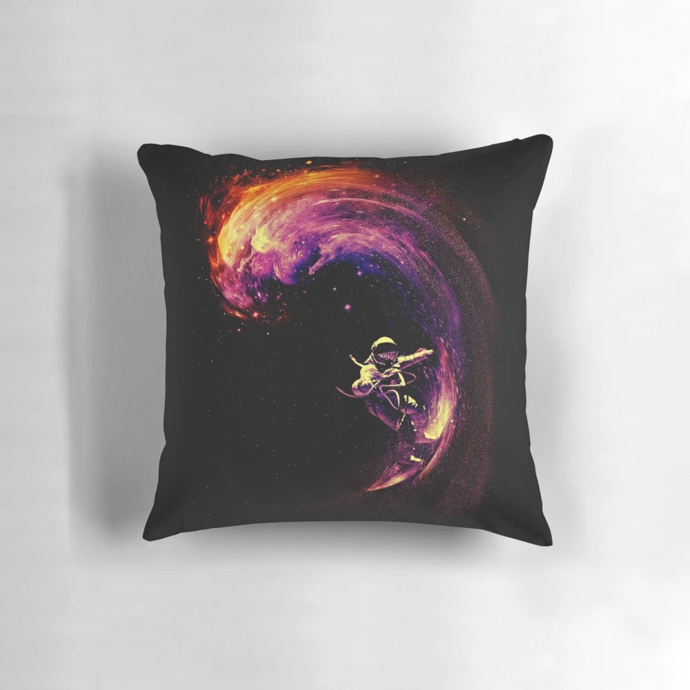 Space surfing pillow with a colorful cosmic design featuring stars, galaxies, and waves