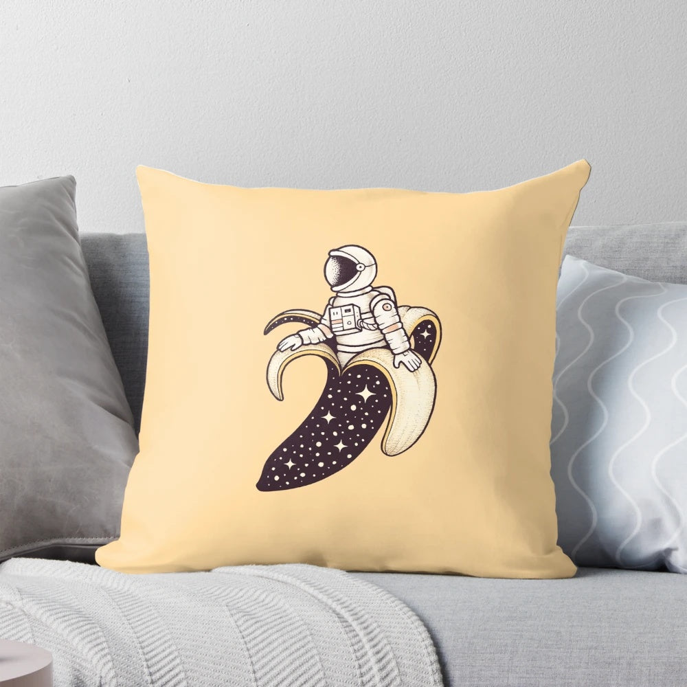 A whimsical pillow featuring a banana astronaut floating in a surreal, cosmic landscape