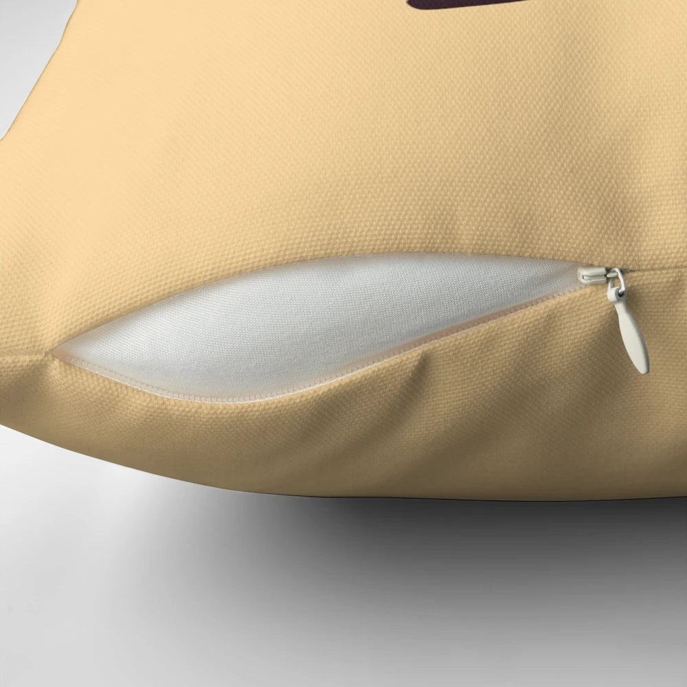 A whimsical pillow featuring a banana astronaut floating in a surreal, cosmic landscape