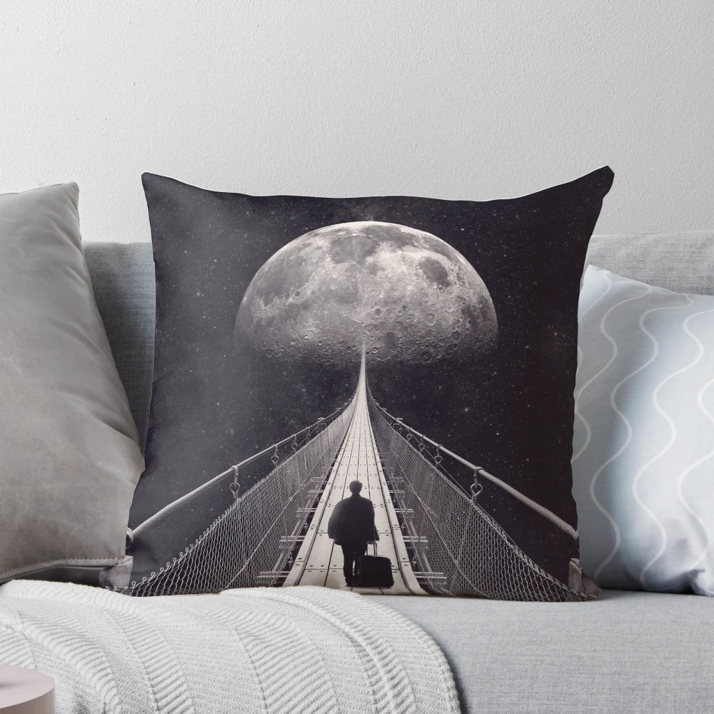 A surreal, space-themed pillow with stars, a moon, and a lone astronaut floating in the galaxy.