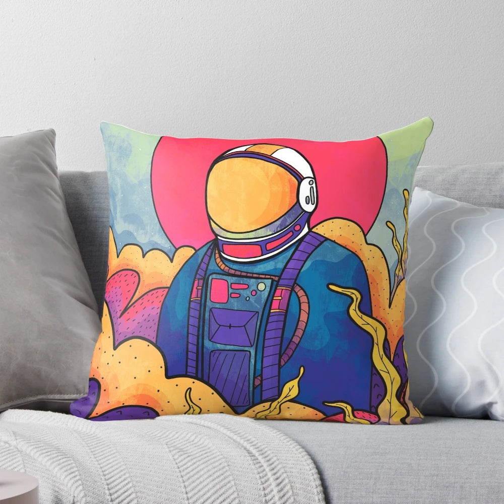 A vibrant, colorful pillow featuring a stylized astronaut figure exploring an otherworldly landscape.