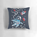 Cozy space-themed pillow featuring an astronaut floating in the cosmos