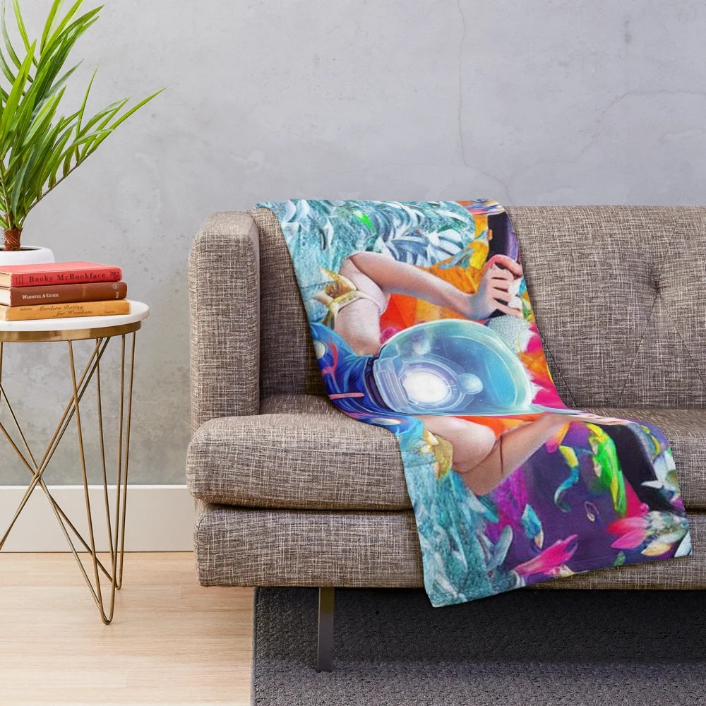 Alien-inspired plush blanket with vibrant cosmic design