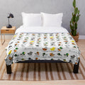 Plush blanket featuring a guide to British ducks by Elliestrations