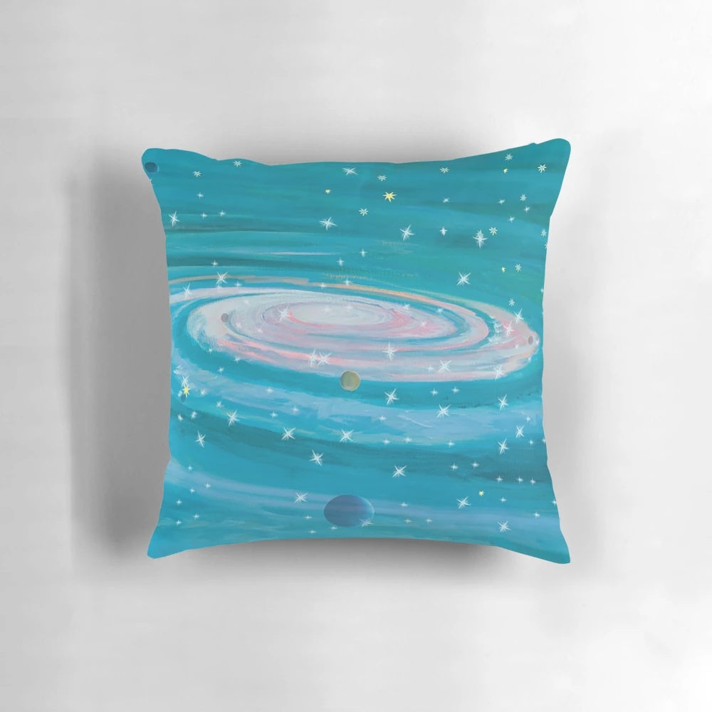Colorful pillow design featuring stars, planets, and cosmic elements for a space-themed travel experience.
