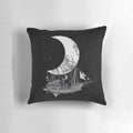 A stylish black and white pillow featuring a crescent moon and space ship design, perfect for adding a touch of adventure and fantasy to any room.