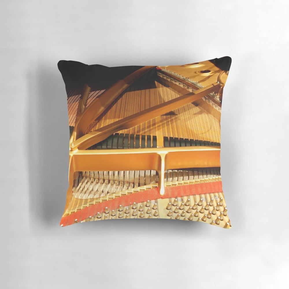A Steinway concert grand piano with its intricate inner mechanisms and strings displayed on a pillow.