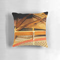 A Steinway concert grand piano with its intricate inner mechanisms and strings displayed on a pillow.