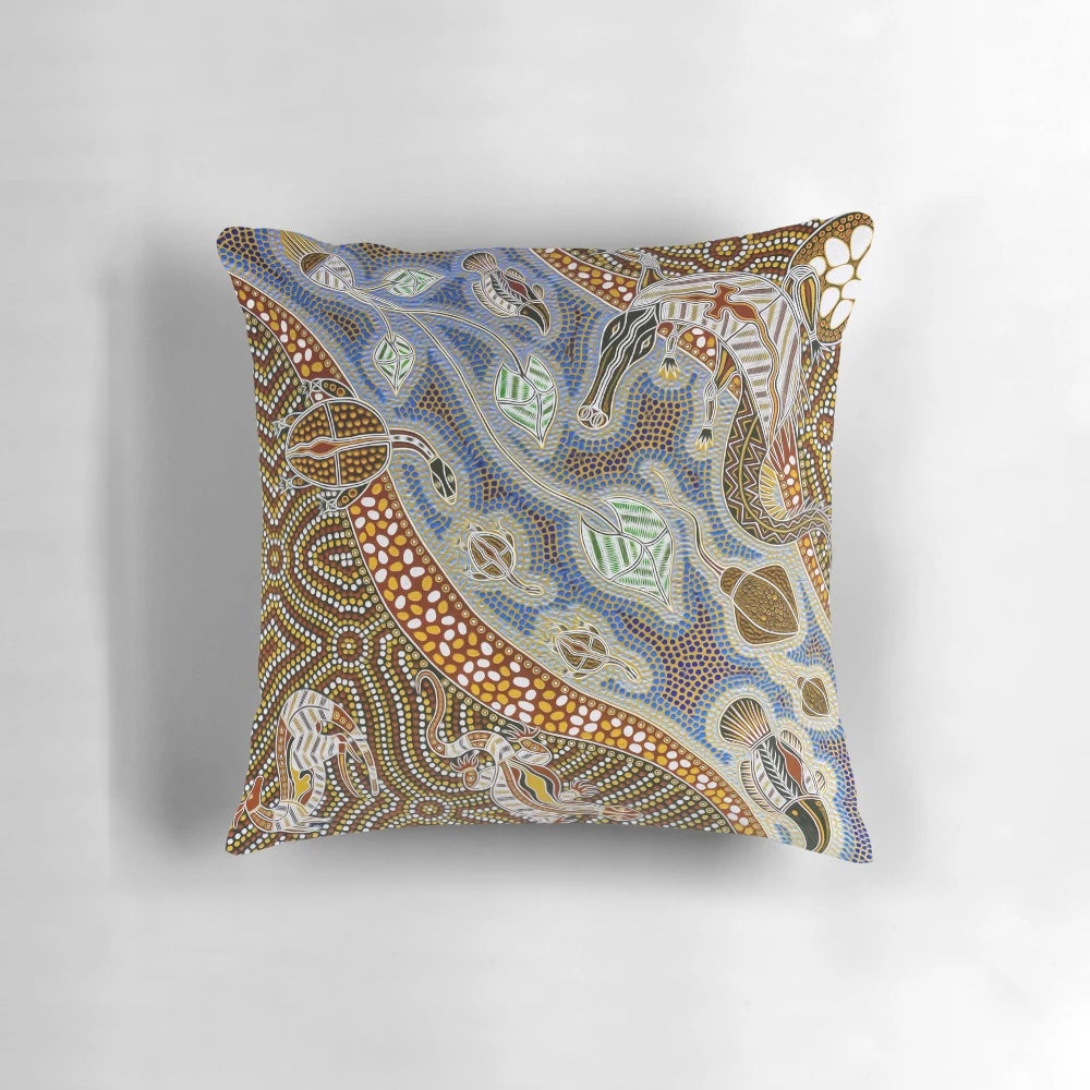 Colorful and intricate aboriginal art design featuring turtles, goannas, and other iconic Australian animals on a premium throw pillow.