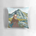 A cozy pillow featuring a whimsical illustration of a Welsh lady exploring the lush, mountainous landscape.