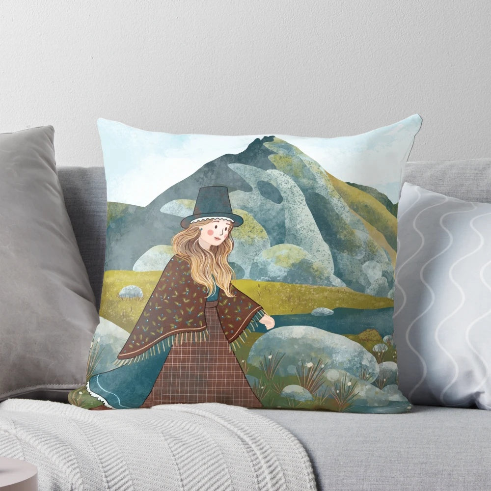 A cozy pillow featuring a whimsical illustration of a Welsh lady exploring the lush, mountainous landscape.