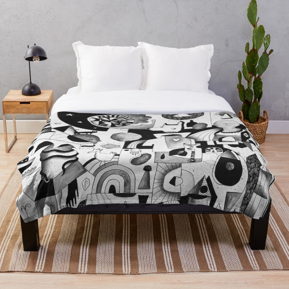 Plush blanket with abstract adventure-themed design
