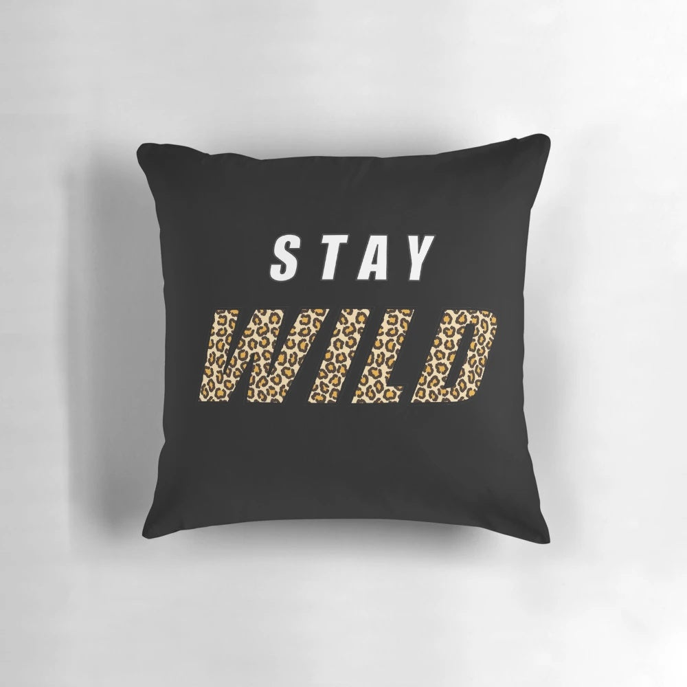 Stylish pillow featuring the quote "Stay Wild" and a design inspired by nature and adventure, featuring the name "Ben Azelart".