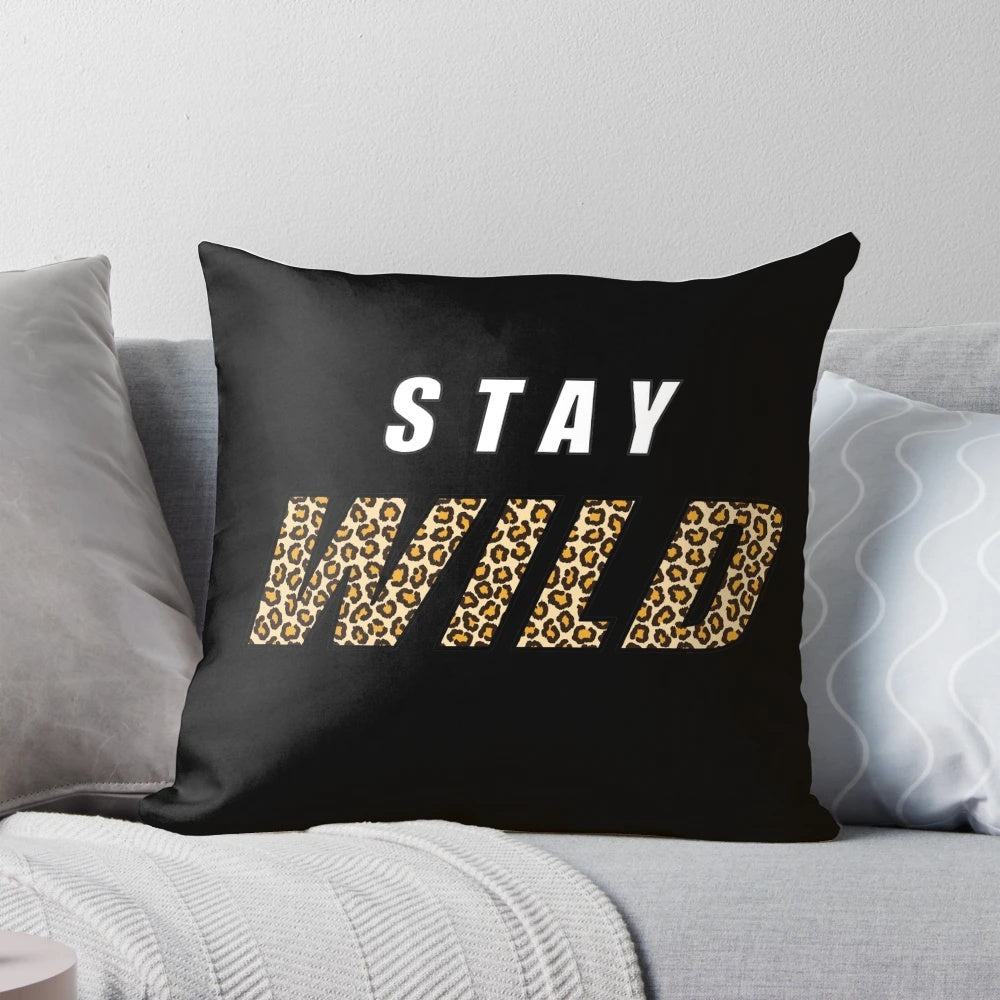 Stylish pillow featuring the quote "Stay Wild" and a design inspired by nature and adventure, featuring the name "Ben Azelart".