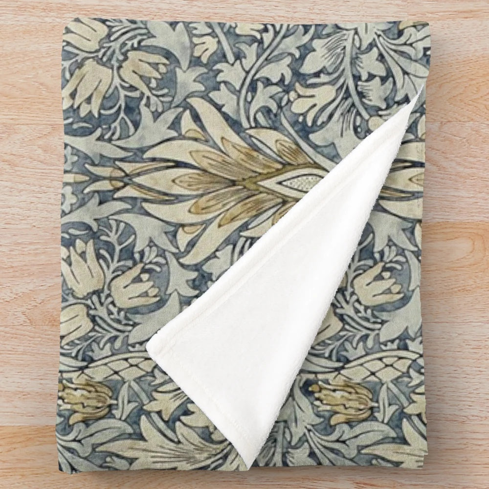 Plush blanket featuring the iconic snakeshead pattern designed by William Morris