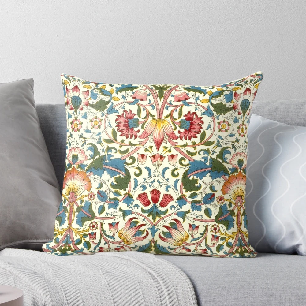 Close-up of a beautifully detailed, vintage-inspired floral pattern pillow in the Lodden style by William Morris.